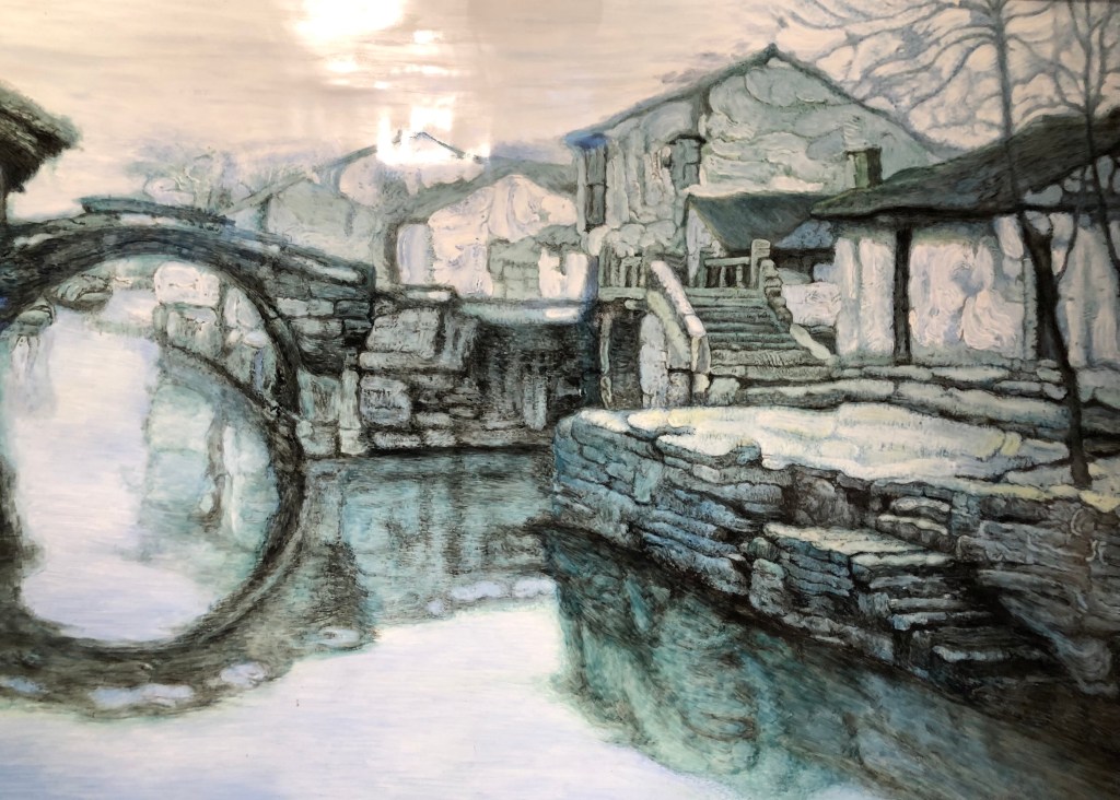 “Memories of Hometown: Two Bridges” by Chen Yifei (1946-2005). Chen Yifei, a well-known Shanghainese contemporary artist, studied Western art at Hunter College in 1980. Armand Hammer, an oil tycoon and art connoisseur, sponsored Chen’s solo exhibitions in Manhattan in the early 1980s. Hammer purchased this painting and presented it to Deng Xiaoping as a gift during Hammer’s highly publicized visit to China in 1985, making Chen a household name in China. Chen returned to Shanghai to work in 1990 and actively engaged in international cultural exchanges. (Photo taken in Chen Yifei Art Gallery (Yifei Vision).)