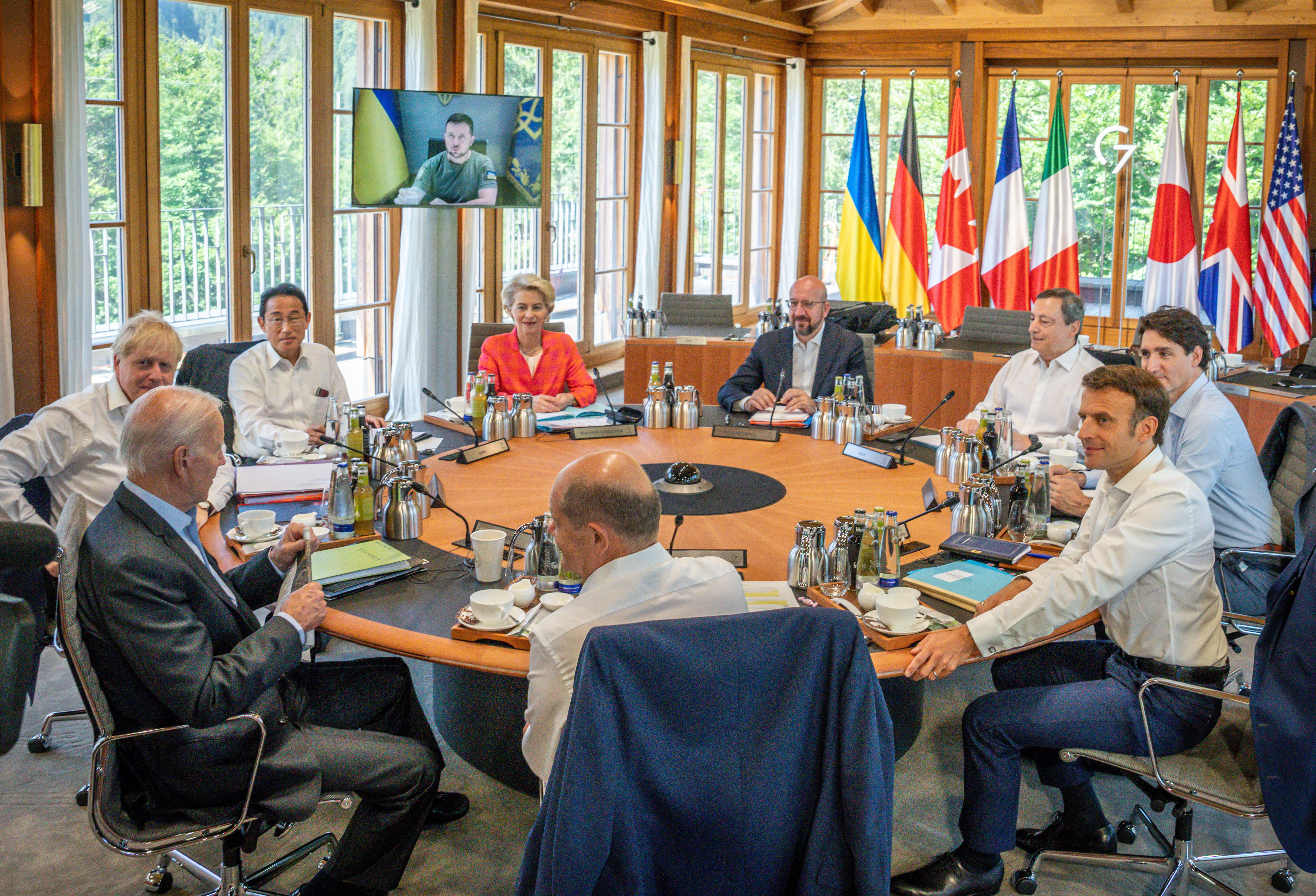 Summit participants German Chancellor Olaf Scholz (center front, SPD), U.S. President Joe Biden (l-r, clockwise), Boris Johnson, Prime Minister of the United Kingdom, Fumio Kishida, Prime Minister of Japan, Ursula von der Leyen, EU Commission President, Charles Michel, EU Council President, Mario Draghi, Prime Minister of Italy, Justin Trudeau, Prime Minister of Canada and Emmanuel Macron, President of France, sit at the working session, while Ukrainian President Volodymyr Selenskyj is connected via video conference. The G7 summit of economically strong democracies is about continued support, including long-term support, for his country. In addition, consultations with the five host countries India, Indonesia, South Africa, Senegal and Argentina will focus on climate protection and the global food crisis resulting from the Ukraine war.