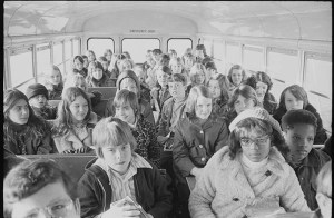 Children in Charlotte, North Carolina ride a bus together, 1973