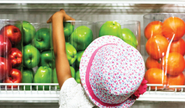 Child reaching for fruit