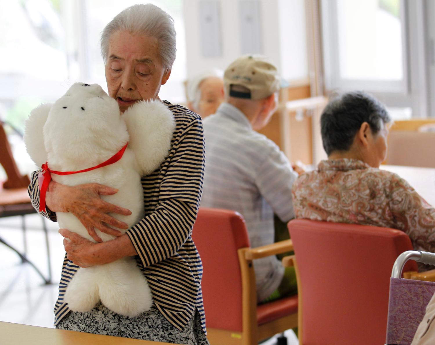 Satsuko Yatsuzaka with a therapeutic robot