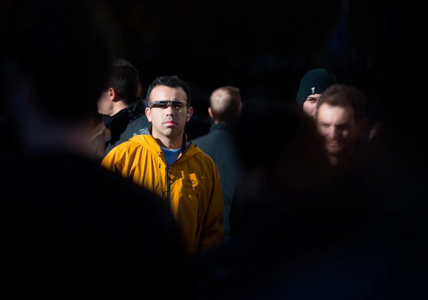 A man wears a pair of Google glasses as he stands at Madrid's Puerta del Sol square December 14, 2013. REUTERS/Sergio Perez