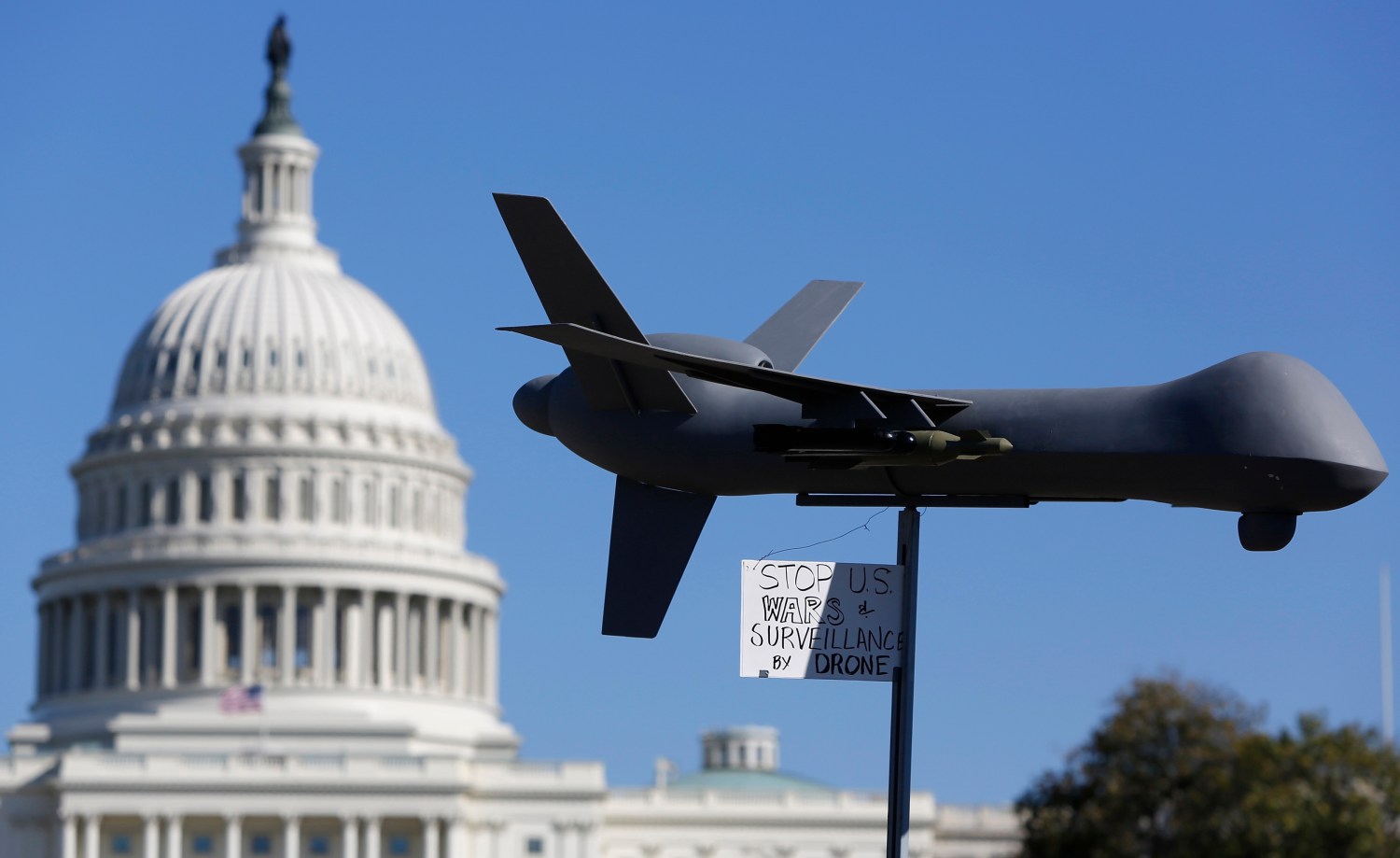 Reuters/Jonathan Ernst - Demonstrators deploy a model of a U.S. drone aircraft at the "Stop Watching Us: A Rally Against Mass Surveillance" near the U.S. Capitol in Washington, October 26, 2013
