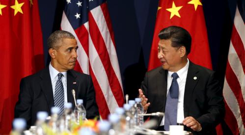 Obama and Xi Jinping with flags.