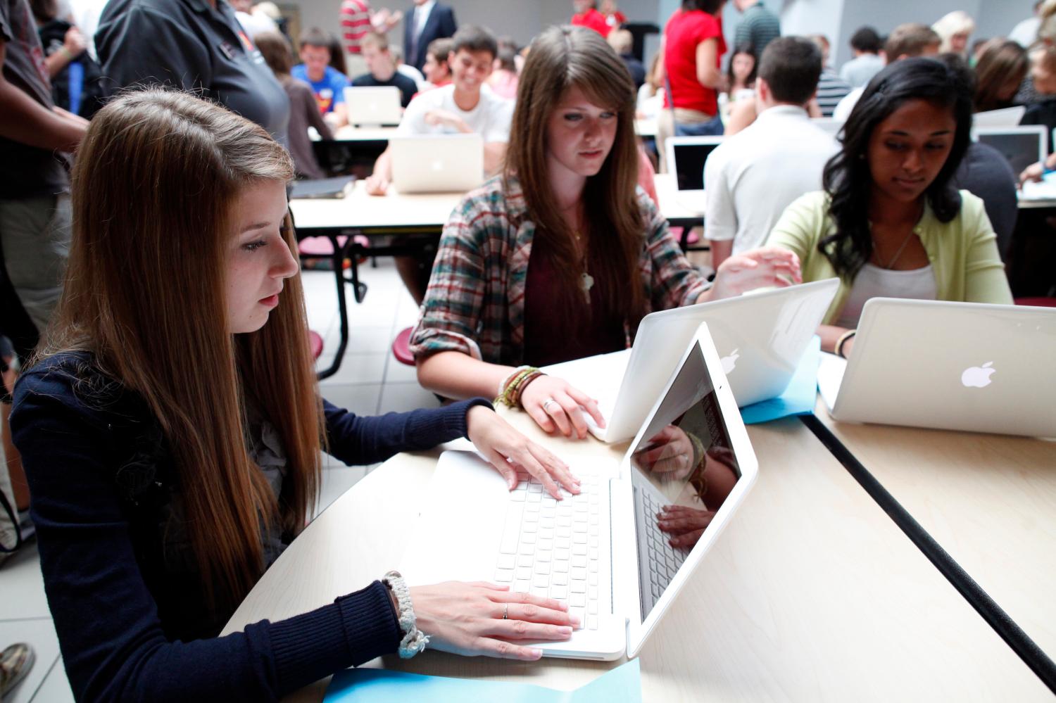 Female students work on computers.