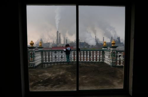 Girl in China under polluted skies