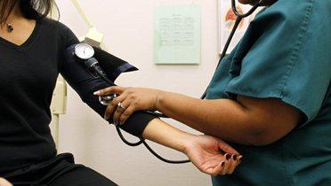 A patient gets their blood pressure checked