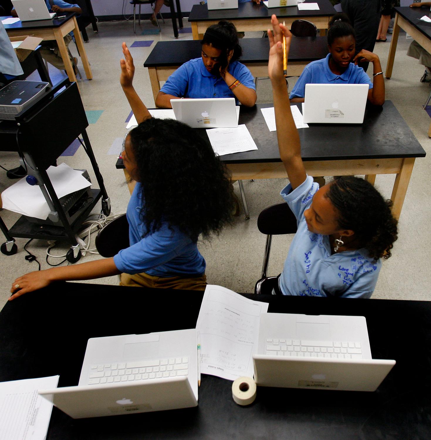 Students raise hands