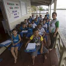 Children of the floating Municipal School Sao Jose II pose for a picture along the Amazonas River bank in a rural area of Manaus, Brazil, June 18, 2015.