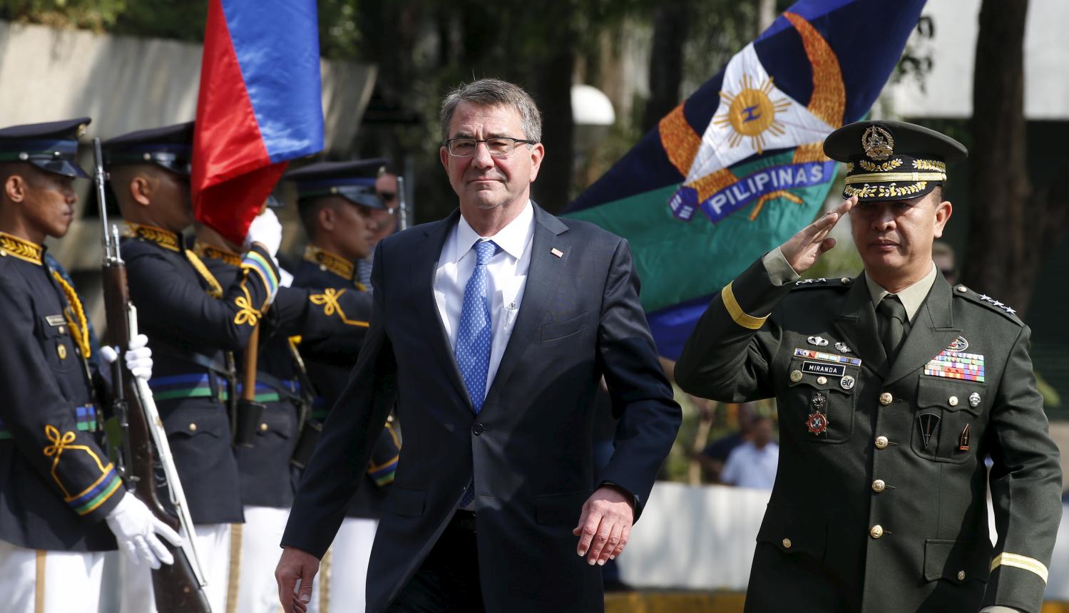 U.S. Defence Secretary Ash Carter walks past honour guards at Camp Aguinaldo to attend the closing ceremony of a U.S.-Philippine military exercise dubbed "Balikatan" (shoulder to shoulder) in Quezon City, Metro Manila, April 15, 2016. At right escorting him is Lieutenant General Glorioso Miranda. REUTERS/Erik De Castro - RTX2A1SA