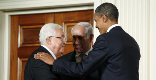 U.S. President Barack Obama (R) greets Palestinian President Mahmoud Abbas (L) and Israeli Prime Minister Benjamin Netanyahu, as leaders gathered to deliver a joint statement on Middle East Peace talks in the East Room of the White House in Washington September 1, 2010. REUTERS/Jason Reed