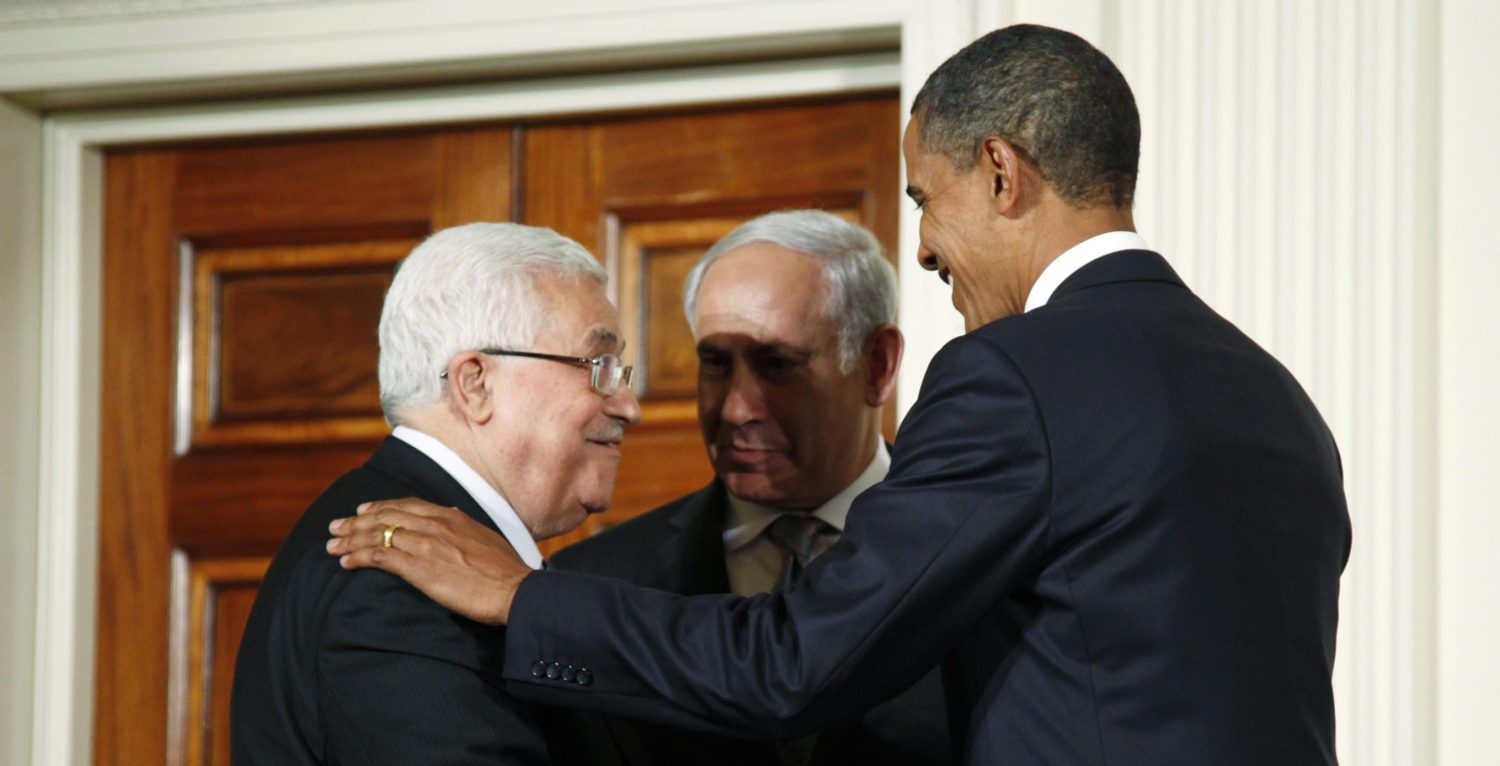 U.S. President Barack Obama (R) greets Palestinian President Mahmoud Abbas (L) and Israeli Prime Minister Benjamin Netanyahu, as leaders gathered to deliver a joint statement on Middle East Peace talks in the East Room of the White House in Washington September 1, 2010. REUTERS/Jason Reed