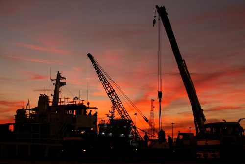 An oil rig in the sunset.