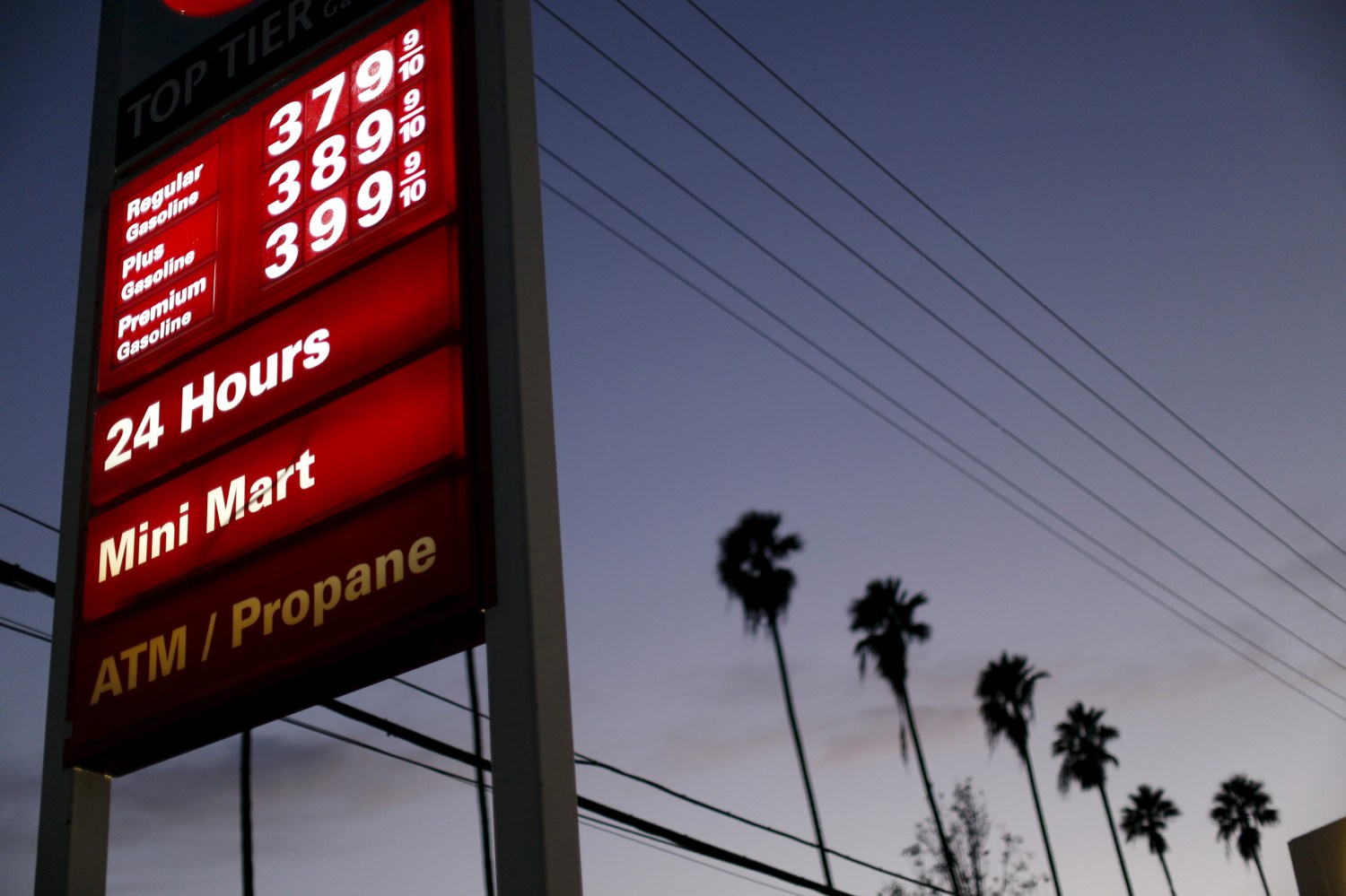 Regular unleaded petrol is seen priced at $3.79 per gallon ($1 per litre) at a 76 gas station in Los Angeles, California February 4, 2016. REUTERS/Mario Anzuoni