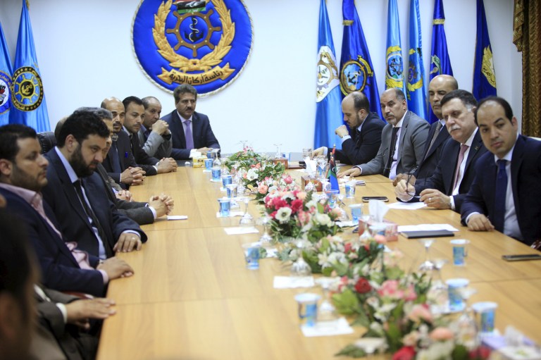 Fayez Serraj, Libyan prime minister-designate under the proposed unity government, attends a meeting with officials of municipal council of Tripoli in Tripoli, Libya. Photo credit: Reuters/Ismail Zitouny.