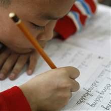 A HIV-positive boy practices his writting at a social centre in Ba Vi district, outside Hanoi November 30, 2009. An estimated 33.4 million people worldwide are infected with the AIDS virus, up from 33 million in 2007, but more people are living longer due to the availability of drugs, according to a United Nations report.