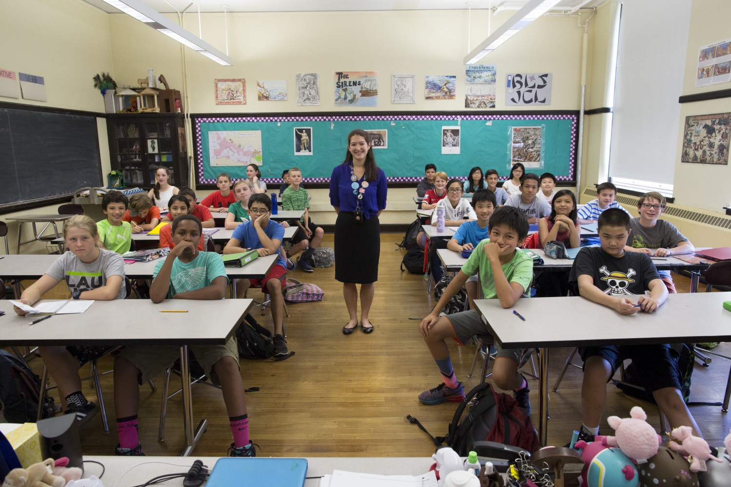 Teacher Elizabeth Moguel poses for a photograph with her seventh grade Latin class at Boston Latin School in Boston, Massachusetts September 17, 2015.
