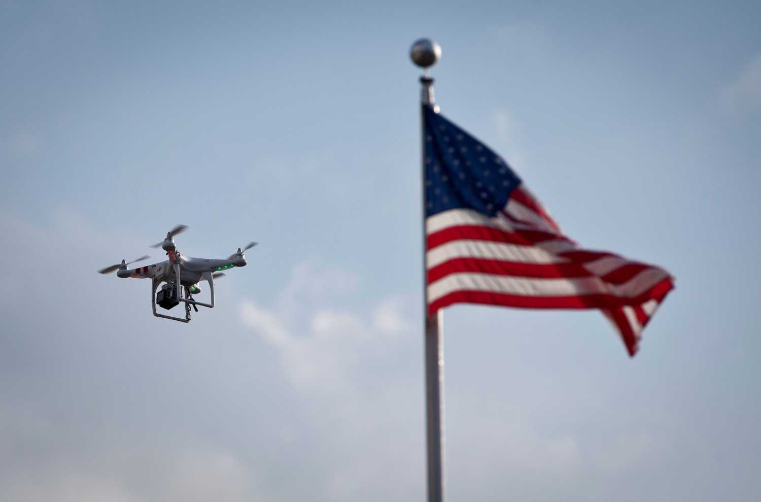 A small drone helicopter operated by a paparazzi records singer Beyonce Knowles-Carter (not seen) as she rides the Cyclone rollercoaster while filming a music video on Coney Island in New York August 29, 2013. REUTERS/Carlo Allegri