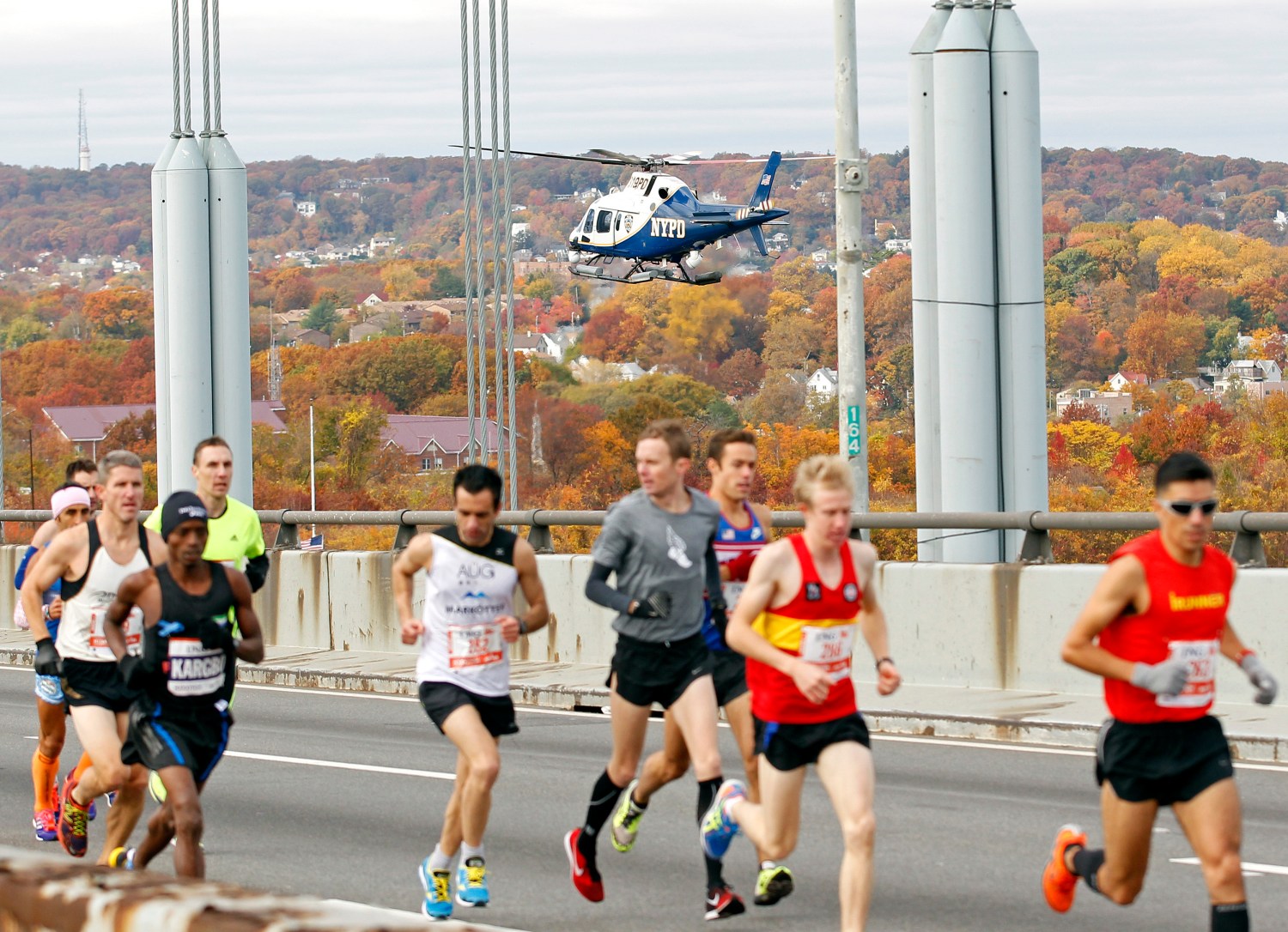 A New York Police Department helicopter watches over runners at the start of the New York City Marathon in New York, November 3, 2013. REUTERS/Adam Hunger