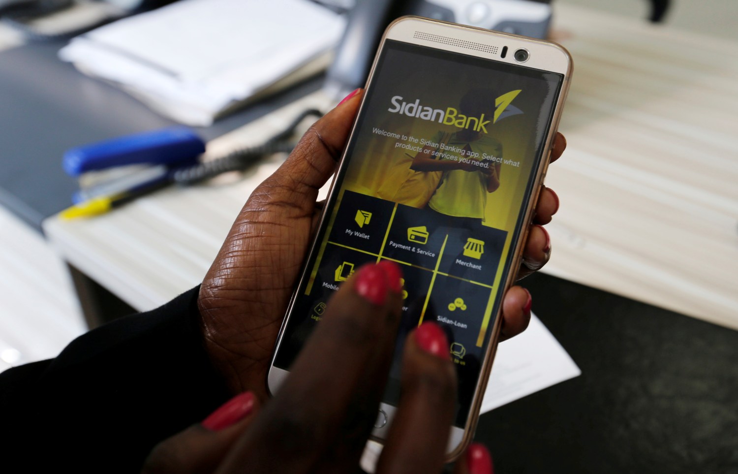 Sidian Bank customer accessing mobile banking app on cell phone