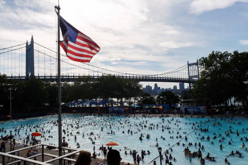 People enjoy a day in the pool during a heat wave called "Heat Dome" in the Astoria borough of New York, U.S., July 24, 2016. REUTERS/Eduardo Munoz - RTSJFZU
