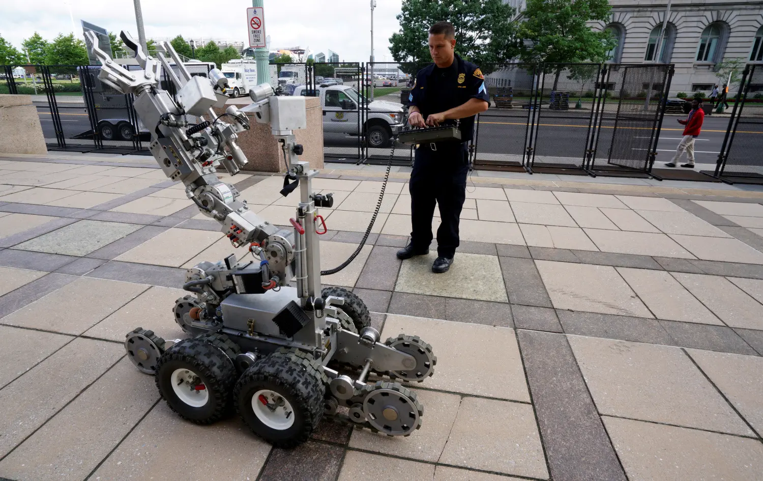 Cleveland police bomb squad technician Sgt. Tim Maffo-Judd demonstrates a Remotec F5A explosive ordnance device robot