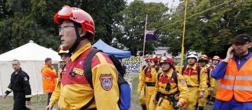 Relief workers from Taiwan walk though a tent city in central Christchurch, home to relief workers following Tuesday's earthquake February 26, 2011.