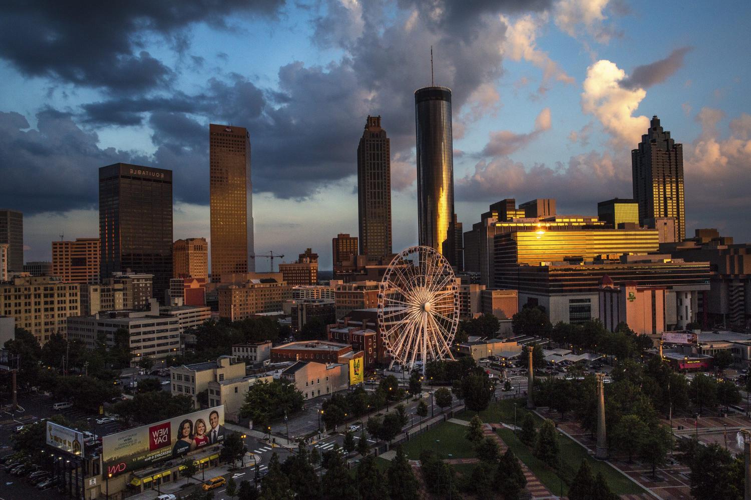 SkyView Atlanta, a 200-foot (61-meter) tall Ferris wheel with 42 gondolas, is seen on the South end of Centennial Park in downtown Atlanta, Georgia July 19, 2013. The Ferris wheel, which was previously located in Paris, Switzerland, and Pensacola, Florida, opened to the public in Atlanta on July 16. This the view from the 11th floor of the Omni Hotel at CNN Center. Picture taken on July 19, 2013. REUTERS/Chris Aluka Berry (UNITED STATES - Tags: ENTERTAINMENT CITYSPACE SOCIETY) - RTX11UC2