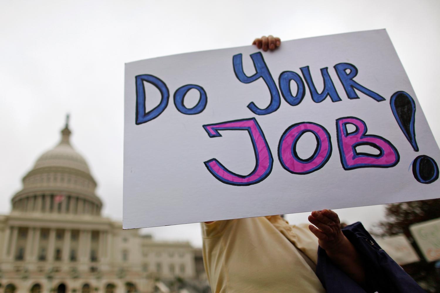 Federal workers demonstrate for an end to the U.S. government shutdown on the west front of the U.S. Capitol in DC