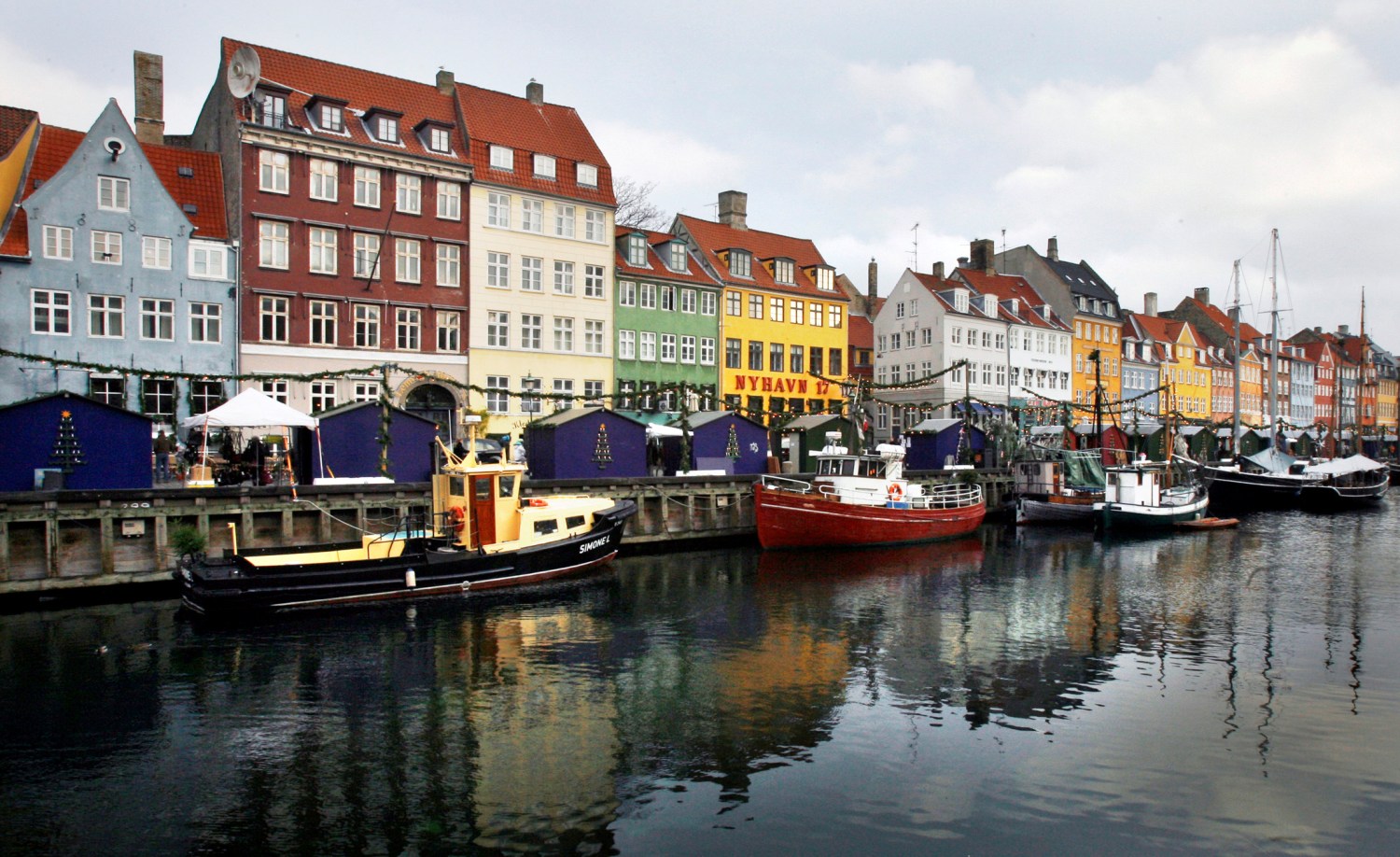 Boats are seen anchored at the 17th century Nyhavn district, home to many shops and restaurants in Copenhagen