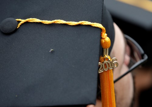 A graduating student of the City College of New York wears his 2016 cap during the College's commencement ceremony in the Harlem section of Manhattan, New York, U.S., June 3, 2016. REUTERS/Mike Segar - RTX2FKPR