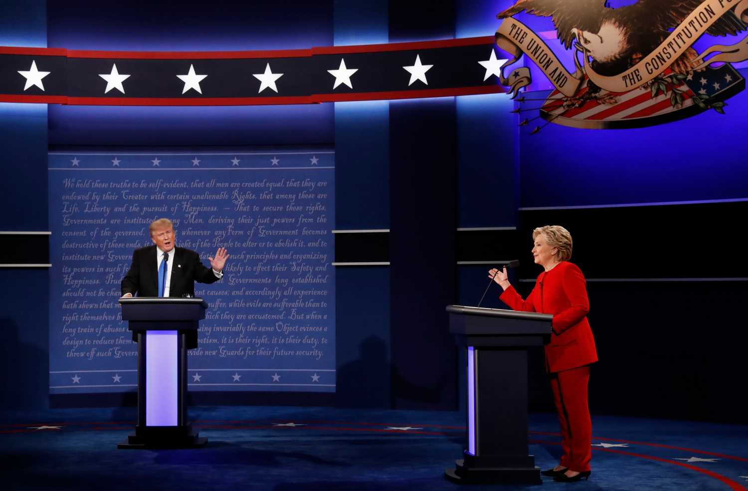 Republican U.S. presidential nominee Donald Trump and Democratic U.S. presidential nominee Hillary Clinton discuss a point during their first presidential debate at Hofstra University