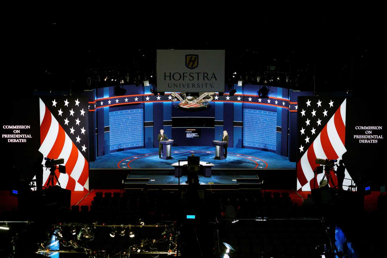 Hostra University students playing the roles of the candidates and moderator go through a rehearsal for the first U.S. presidential debate at Hofstra University in Hempstead, New York September 25, 2016. Left to right are Joseph Burch, Christian Stewart and Caroline Mullen. REUTERS/Rick Wilking - RTSPCX3
