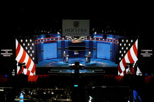 Hostra University students playing the roles of the candidates and moderator go through a rehearsal for the first U.S. presidential debate at Hofstra University in Hempstead, New York September 25, 2016. Left to right are Joseph Burch, Christian Stewart and Caroline Mullen. REUTERS/Rick Wilking - RTSPCX3