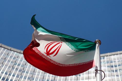 An Iranian flag flutters in front of the United Nations headquarters in Vienna June 17, 2014. Six world powers and Iran began their fifth round of nuclear negotiations on Tuesday in hopes of salvaging prospects for a deal over Tehran's disputed atomic activity by a July deadline. REUTERS/Heinz-Peter Bader (AUSTRIA - Tags: POLITICS ENERGY) - RTR3U83F