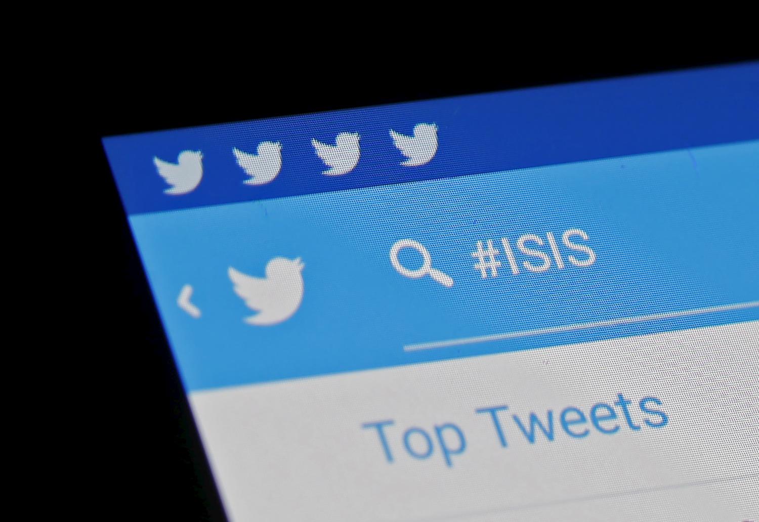 The Islamic State hashtag (#ISIS) is seen typed into the Twitter application on a smartphone in this picture illustration taken in Zenica, Bosnia and Herzegovina, February 6, 2016. Twitter Inc has shut down more than 125,000 terrorism-related accounts since the middle of 2015, most of them linked to the Islamic State group, the company said in a blog post on Friday. REUTERS/Dado Ruvic - RTX25PB6