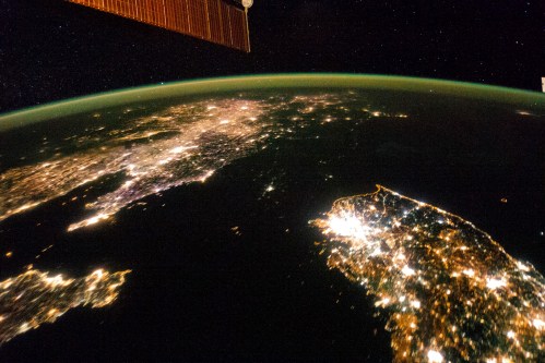 A NASA image released on February 24, 2014 shows a photo taken by the Expedition 38 crew aboard the International Space Station (ISS) on January 30, 2014 of the night view of the Korean Peninsula, and North Korea in the middle is almost completely dark compared to neighboring South Korea (bottom right) and China (top left). The photograph was cropped and enhanced to improve contrast, and lens artifacts have been removed at source. REUTERS/NASA-JSC/Handout (OUTER SPACE - Tags: ENVIRONMENT SCIENCE TECHNOLOGY TPX IMAGES OF THE DAY) ATTENTION EDITORS - THIS IMAGE HAS BEEN SUPPLIED BY A THIRD PARTY. IT IS DISTRIBUTED, EXACTLY AS RECEIVED BY REUTERS, AS A SERVICE TO CLIENTS. FOR EDITORIAL USE ONLY. NOT FOR SALE FOR MARKETING OR ADVERTISING CAMPAIGNS - RTR3FOZZ