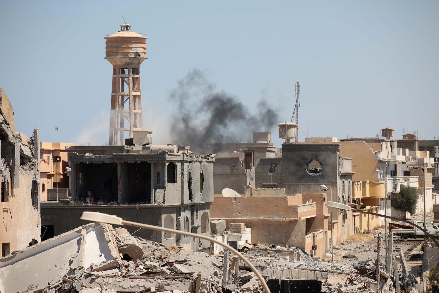 Smoke rises following what witnesses said was an air strike during a battle between Libyan forces allied with the U.N.-backed government and Islamic State militants in Sirte, Libya September 7, 2016. REUTERS/Hani Amara - RTX2OJ7B