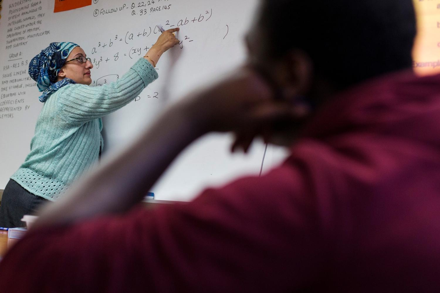 A Newark Prep Charter School student listens to math teacher Faiza Sheikh, give a lesson at the school in Newark, New Jersey April 16, 2013. REUTERS/Lucas Jackson (UNITED STATES - Tags: EDUCATION) - RTR3NGIU