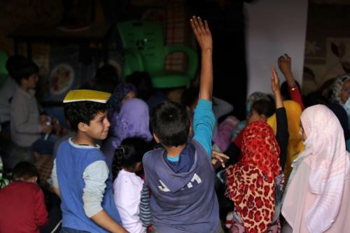 Internally displaced children attend a class inside a cave in the rebel-controlled village of Tramla, in Idlib province, Syria March 27, 2016. A group of people, who live in a cave, have set up a school for children during the day. The cave accommodates around 120 students, divided into two shifts. REUTERS/Khalil Ashawi SEARCH "SYRIA SCHOOLS" FOR THIS STORY. SEARCH "THE WIDER IMAGE" FOR ALL STORIES