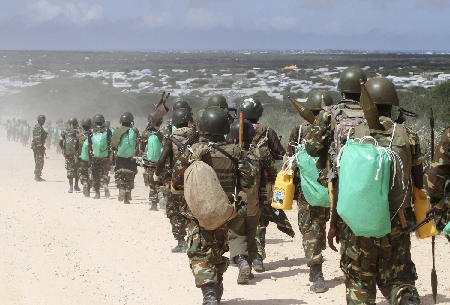 Picture of African Union Mission in Somalia peacekeepers and a refugee camp.