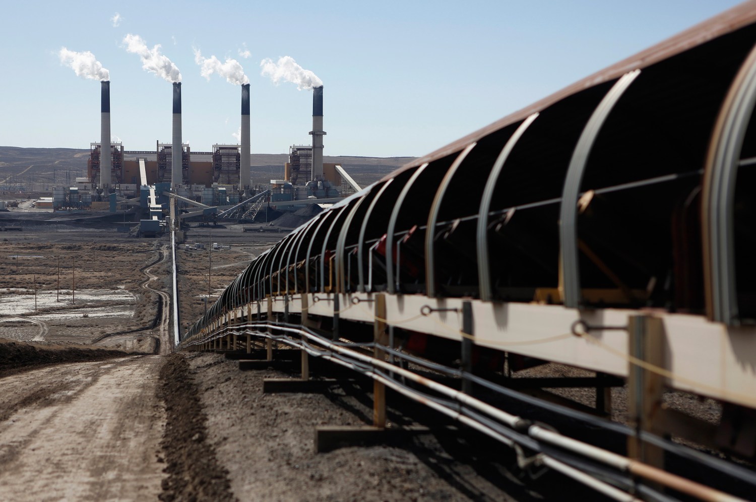 Coal is transported via conveyor belt to the coal-fired Jim Bridger Power Plant that supplied by the neighboring Jim Bridger mine that is owned by energy firm PacifiCorp and the Idaho Power Company, outside Point of the Rocks, Wyoming March 14, 2014.