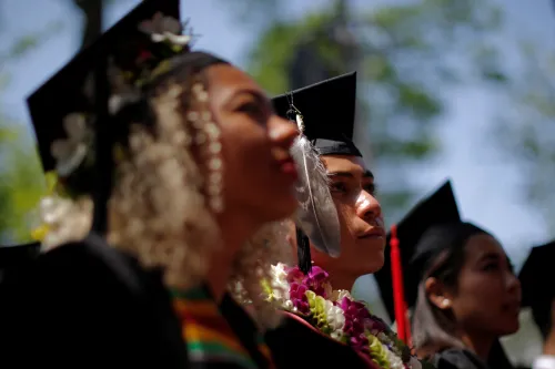 Graduating students listen during the 365th Commencement Exercises at Harvard University in Cambridge