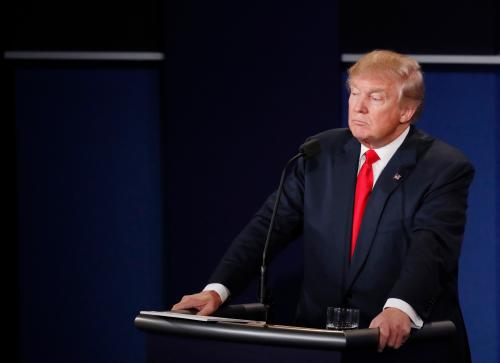 Republican U.S. presidential nominee Donald Trump listens as Democratic U.S. presidential nominee Hillary Clinton speaks during their third and final 2016 presidential campaign debate at UNLV in Las Vegas, Nevada, U.S., October 19, 2016. REUTERS/Mark Ralston/Pool - RTX2PM78