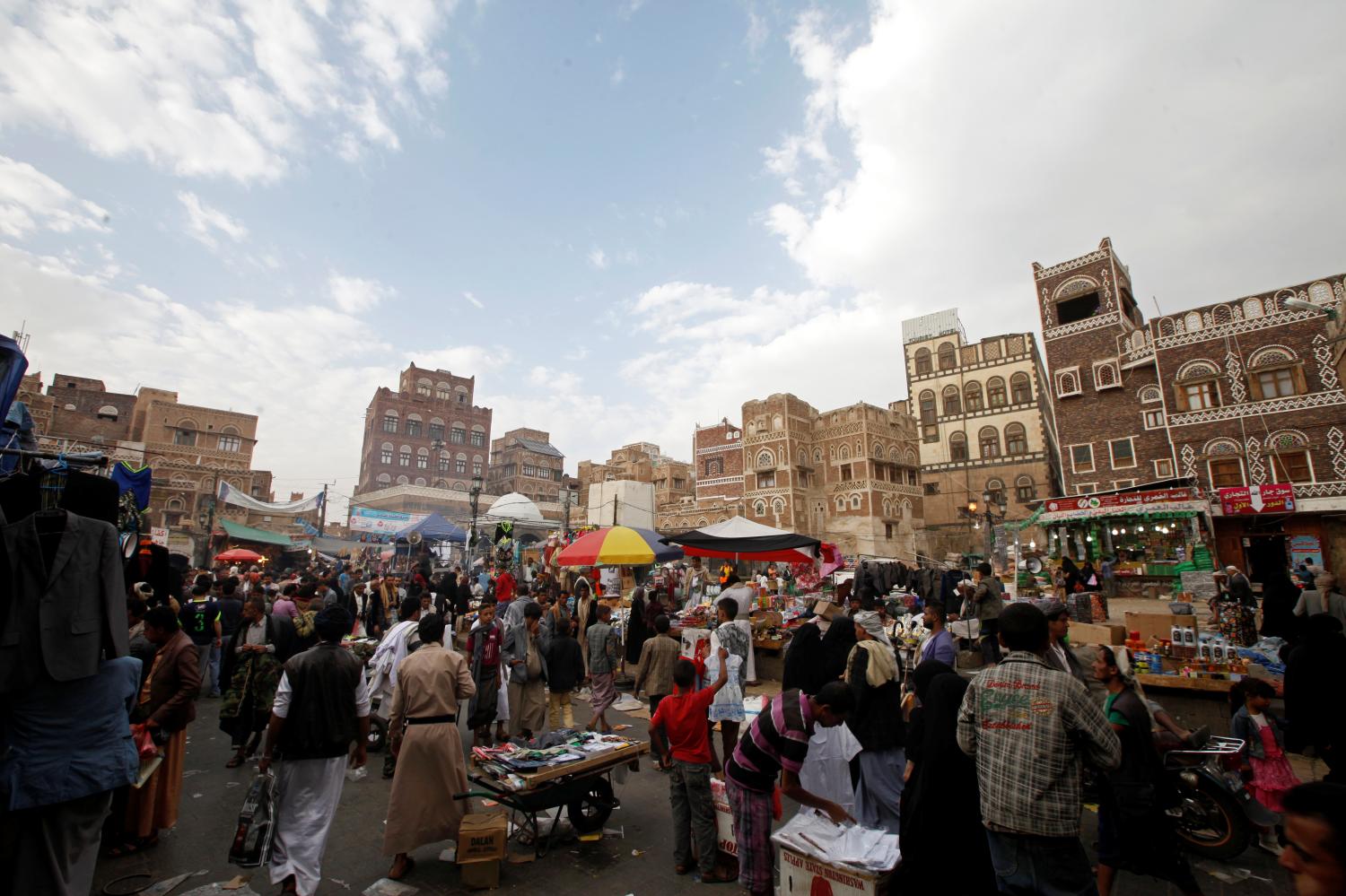 People browse items at the old market, ahead of the Eid Al-Adha festival, in the historic city of Sanaa, Yemen September 11, 2016. REUTERS/Mohamed al-Sayaghi - RTSN91T