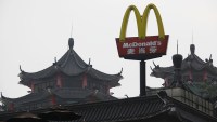 A McDonald's sign is displayed outside its outlet, the first one which opened in China in 1990, at the southern Chinese city of Shenzhen neighbouring Hong Kong March 18, 2013. McDonald's Corp gave away more than a million breakfast McMuffins across China on Monday, a few days after Chinese state television aired its annual expose on corporate malpractice to mark World Consumer Rights Day. The promotion, the U.S. fast food chain says, was purely coincidental.    REUTERS/Bobby Yip (CHINA - Tags: FOOD BUSINESS LOGO POLITICS SOCIETY) - RTR3F51T