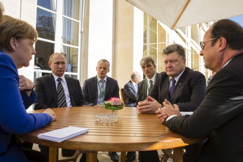 (R-L, clockwise) French President Francois Hollande, German Chancellor Angela Merkel, Russian President Vladimir Putin and Ukrainian President Petro Poroshenko attend a meeting in Paris, France, October 2, 2015. France hosts a meeting with leaders of Russia, Germany and Ukraine in Paris for talks about Ukraine which were likely to be overshadowed by the conflict in Syria. REUTERS/Ukrainian Presidential Press Service/Mikhailo Palinchak/Pool ATTENTION EDITORS - THIS PICTURE WAS PROVIDED BY A THIRD PARTY. REUTERS IS UNABLE TO INDEPENDENTLY VERIFY THE AUTHENTICITY, CONTENT, LOCATION OR DATE OF THIS IMAGE. FOR EDITORIAL USE ONLY. NOT FOR SALE FOR MARKETING OR ADVERTISING CAMPAIGNS. THIS PICTURE IS DISTRIBUTED EXACTLY AS RECEIVED BY REUTERS, AS A SERVICE TO CLIENTS. TPX IMAGES OF THE DAY - RTS2R2I