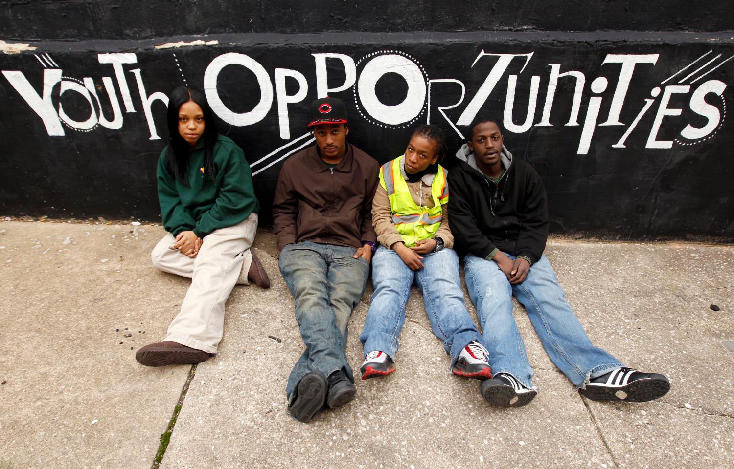 Youth Opportunity (YO!) Academy studens (L-R) Samira Gardner, Ray Allan, Rashia Gerald and Khaalid Brooks sit in front of a wall at the Westside Youth Opportunity Center in Baltimore March 9, 2011. The 15 percent unemployment rate for 20- to 24-year-olds in March was more than double the rate for those over age 55, according to Labor Department data. Picture taken March 9, 2011. To match Feature AGING/CONFLICT REUTERS/Kevin Lamarque (UNITED STATES - Tags: SOCIETY EMPLOYMENT BUSINESS) - RTR2KYIB