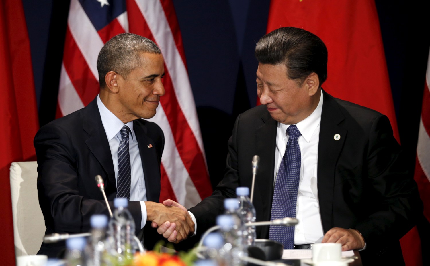 U.S. President Barack Obama shakes hands with Chinese President Xi Jinping during their meeting at the start of the climate summit in Paris November 30, 2015.