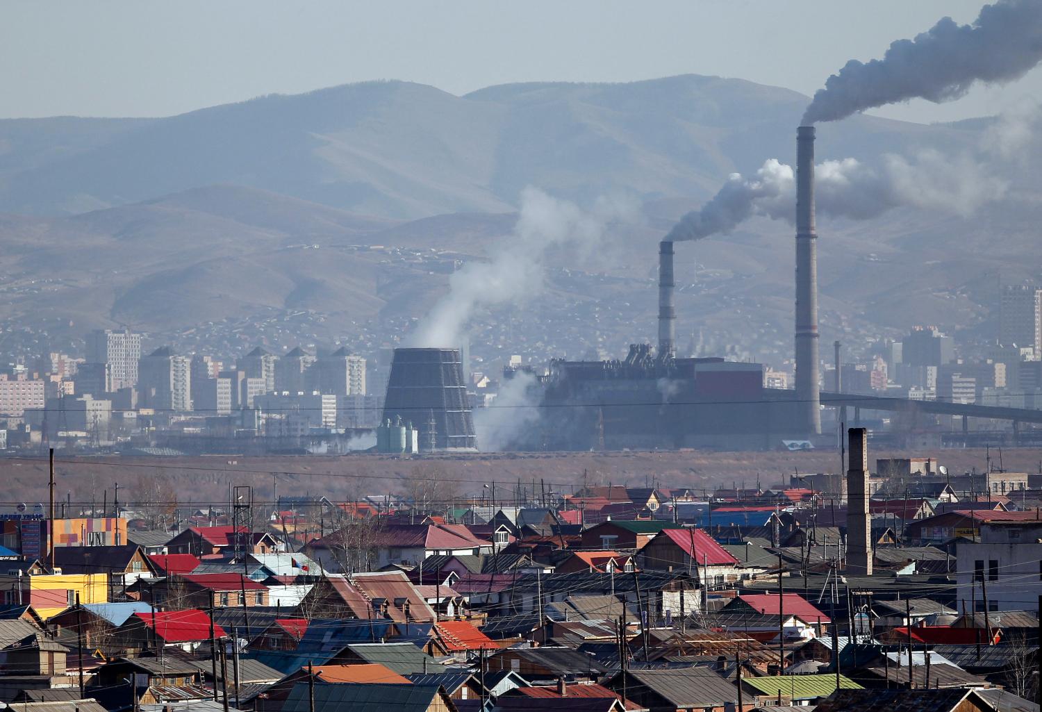 Smoke billows from the chimneys of a coal-burning power plant in Ulan Bator October 14, 2011.